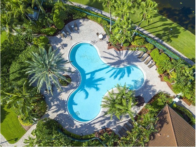 Muano Delray Beach pool drone overview | Apartment Homes in Delray Beach , FL | Murano of Delray Beach Apartment Homes | Delray Beach, FL Apartment Rentals | Luxury Apartments in Delray Beach , FL | For Rent Delray Beach, FL - Murano Delray Beach