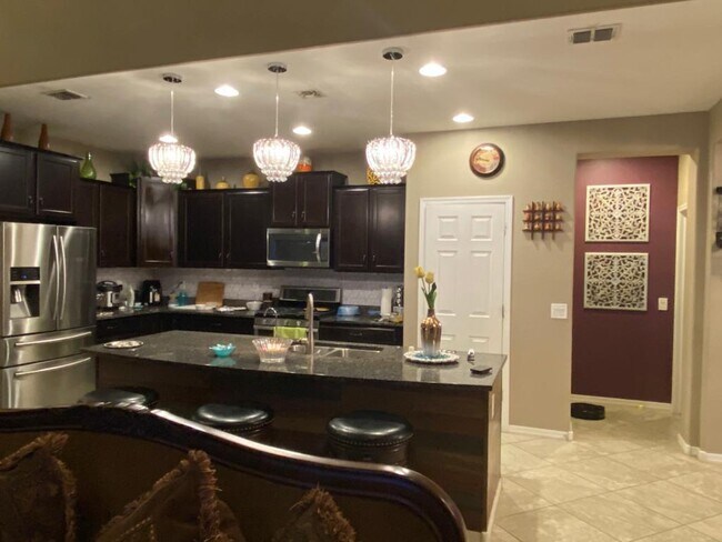 Kitchen view from living room - 2627 W Gray Wolf Trl