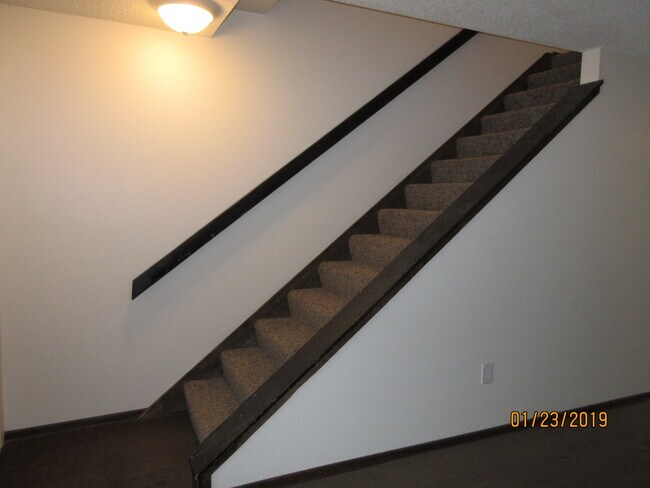 stairway to bedrooms, bath - 8910 E Broadway Ave