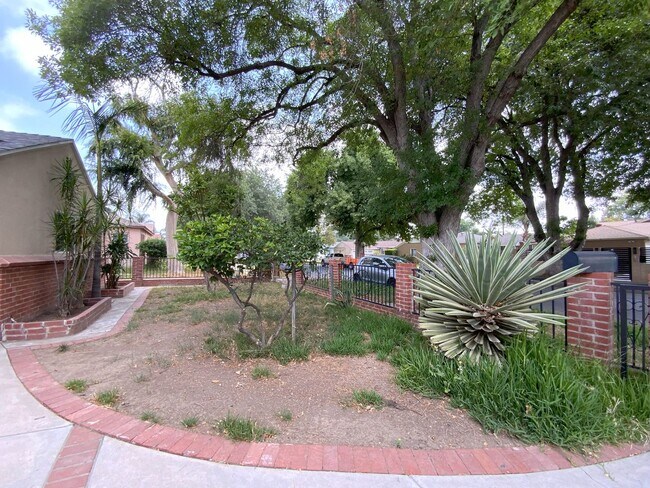 Building Photo - Charming 4-Bedroom Home on a Beautiful Tre...