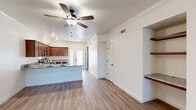 Located at 7355 N Willow Ave in Fresno, CA, this well-appointed single-story home offers a comfortable and functional layout across two bedrooms and two bathrooms. The open-concept living and dining area flows seamlessly into the kitchen, creating a welcoming, connected space ideal for everyday living. Durable hardwood-style flooring runs throughout the main living areas, complemented by crown molding and ceiling fans that add a clean, polished touch.

The kitchen features warm wood cabinetry, granite countertops, stainless steel appliances including a refrigerator, and a peninsula that defines the dining space while maintaining the open feel. A dedicated pantry provides additional storage convenience.

The bedrooms offer a calm retreat, with the primary bedroom providing a generous footprint, a ceiling fan, and natural light through a window with vertical blinds. The second bedroom features soft carpeting and a similar window treatment. Both bathrooms are well-finished, with one featuring granite vanity countertops, rich wood cabinetry, hardwood-style flooring, and a tub-shower combination with sliding glass doors.

Additional highlights include an in-unit laundry area with a full-size washer and dryer, ample closet storage throughout, an attached garage, and a private enclosed patio. The home combines practical amenities with tasteful finishes throughout.