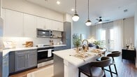 This 530 square foot, one-bedroom apartment in Austin, TX showcases a modern and efficient design. The open-concept layout seamlessly blends the living room, kitchen, and dining area, creating a spacious feel despite the compact footprint. The living room features a comfortable sofa, stylish coffee table, and direct access to a balcony through floor-to-ceiling glass doors, flooding the space with natural light.

The kitchen boasts contemporary finishes with two-tone cabinetry, stainless steel appliances, and a large island with seating, perfect for casual dining or entertaining. Pendant lighting adds a touch of elegance to the space.

The 110 square foot bedroom offers ample space for a queen-sized bed and includes large windows for natural light. A sleek dresser and round mirror complete the room's modern aesthetic. The bathroom features a glass-enclosed shower, modern vanity, and continues the apartment's cohesive design with matching wood-look flooring.

Throughout the apartment, neutral tones and natural textures create a calming atmosphere, while strategic lighting enhances the overall ambiance. The clever use of space and thoughtful design elements make this compact apartment feel much larger than its square footage suggests.