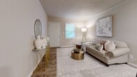 Located at 800 Denzil Dr in Hopkinsville, Kentucky, this single-story home offers a thoughtfully updated interior with a cohesive neutral palette and modern finishes throughout. The living area serves as a welcoming focal point, featuring wood-look flooring, crown molding, and a textured ceiling. Natural light filters through a front-facing window, complementing the warm, inviting atmosphere of the space.

The kitchen is well-equipped and functional, showcasing white shaker-style cabinetry, granite-look countertops, and black appliances including a refrigerator, dishwasher, range, and microwave. Wood-look flooring continues through this space, and a hallway connects the kitchen to the rest of the home seamlessly.

Multiple bedrooms provide comfortable accommodations, each featuring plush carpeting, ceiling fans, crown molding, and windows that allow natural light and outdoor views. The rooms maintain a consistent, airy feel with neutral wall tones throughout.

The bathroom is clean and well-appointed, with a white vanity, light countertop, large mirror, and wood-look flooring. Additional utility space includes built-in shelving and a water heater, offering practical storage solutions. Overall, the home presents a functional and updated living environment.