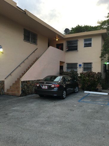 Gated building with parking lot - 160 NE 55th St