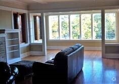 Living room facing south into front sunroom - 1130 W Morse Ave