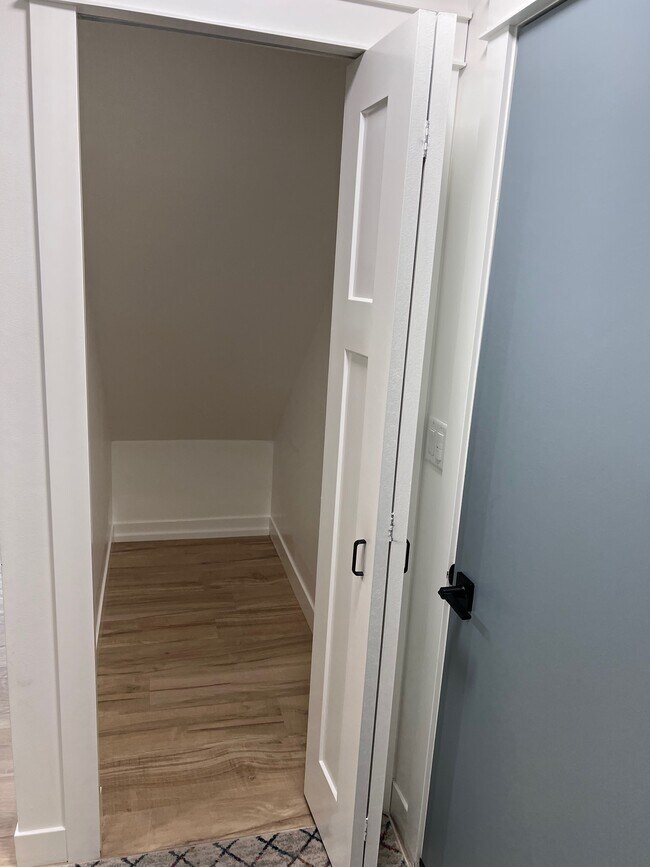 Closet under stairs next to door to the garage - 9935 Fillmore St NE