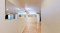 This 530 square foot apartment, located at 650 S Lashley Ln in Boulder, Colorado, offers a unique living experience with its efficient use of space. The single-floor layout comprises one bedroom, measuring 80 square feet, and an impressive four bathrooms, providing ample convenience for residents and guests alike.

The interior is characterized by its bright and airy atmosphere, enhanced by multiple windows that allow natural light to flood the space. The apartment features a mix of flooring, with warm hardwood in some areas and plush carpeting in others, creating distinct zones within the open plan.

The kitchen, though compact, is well-equipped with modern stainless steel appliances, including a refrigerator, stove, and built-in microwave. Honey-colored wooden cabinetry provides ample storage, while granite countertops offer a touch of elegance. A small breakfast bar adds functionality to the space.

The bedroom, while modest in size, includes built-in closets and large windows, making it feel more spacious. The multiple bathrooms are efficiently designed, with at least one featuring a glass-enclosed shower and modern fixtures.

Throughout the apartment, recessed lighting and track lighting systems provide adjustable illumination options. Wall-mounted air conditioning units offer climate control, ensuring comfort year-round. Despite its compact size, this apartment maximizes every square foot, creating a functional and comfortable living space in a desirable Boulder location.