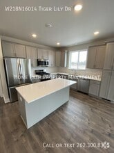 Building Photo - W218N16014 Tiger Lily Dr