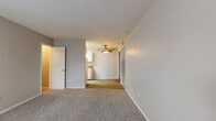Located at 841 Cheyenne Blvd in Nashville, TN, this single-floor, 2-bedroom, 1-bathroom home offers a straightforward and functional layout. The living area features plush carpeting and a textured ceiling, creating a comfortable, cozy atmosphere. A ceiling fan adds both practical ventilation and a classic touch to the space. The layout flows naturally through a hallway connecting the main living area to the bedrooms and bathroom.

The generously sized primary bedroom is carpeted with neutral gray walls and benefits from natural light through a window with views of surrounding greenery. The second bedroom is equally well-lit, with its own window and the same neutral, calming color palette throughout.

The kitchen is equipped with white cabinetry and a white electric range, complemented by hardwood-style flooring that provides a clean contrast to the carpeted living areas. The bathroom features a white vanity with a granite-style countertop, a tub-shower combination with a clean white surround, and tile-style flooring, giving it a neat and functional finish.

A dedicated closet and hallway complete the efficient layout of this home, making it a well-organized and comfortable living space in the Madison area of Nashville.