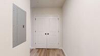 Located at 301 Station Dr in Dublin, PA, this 2-bedroom, 2-bathroom residence offers a thoughtfully laid-out single-floor plan with a clean, modern aesthetic throughout. The open-concept kitchen and living area serves as the heart of the home, showcasing a large center island topped with striking granite countertops, an undermount sink, and stylish pendant lighting. White shaker cabinetry reaches to the ceiling for ample storage, while stainless steel appliances — including a French door refrigerator, range, and built-in microwave — complete the contemporary kitchen. Light wood-tone flooring flows through the main living and kitchen areas, adding warmth to the neutral color palette.

The primary bedroom features vaulted ceilings, recessed lighting, large windows that invite abundant natural light, and light hardwood flooring. It is accompanied by a spacious walk-in closet with wire shelving. The second bedroom is carpeted, generously sized with multiple windows offering neighborhood views, and includes its own closet with built-in rod and shelf systems.

Both bathrooms are finished with wood-look flooring, vanities with stone countertops, and clean white fixtures. One bathroom features a full tub/shower combination. The overall ambiance is bright, neutral, and move-in ready, reflecting a modern and functional design sensibility.
