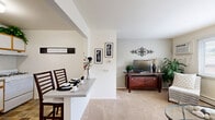 Located at 2355 White Birch Ln in Joliet, IL, this efficiently designed one-bedroom, one-bathroom unit offers a comfortable and functional single-floor layout. The living room features plush carpeting, a large window that brings in generous natural light, and enough space for a full sofa arrangement with a coffee table and entertainment setup — creating a warm, inviting atmosphere. Adjacent to the living area, the kitchen is equipped with white cabinetry accented by gold-toned trim, a gas range, refrigerator, and double-basin sink, complemented by durable tile flooring and a dining area ideal for everyday meals. The bedroom is a well-proportioned retreat finished with soft carpet, a sizable window overlooking the outdoors, and direct access to a dedicated closet with sliding doors — providing ample storage. The full bathroom features wood-look flooring, a dark wood vanity with a single sink, a well-lit mirror, and a tub and shower combination, all presented in a clean, bright finish. Throughout the space, neutral wall tones and consistent finishes create a cohesive and comfortable living environment, making this unit a practical and welcoming home.