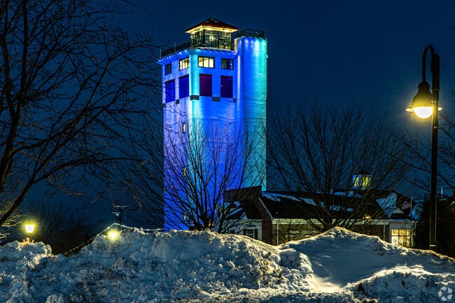 The Door County Maritime Museum shines on Sturgeon Bay at night.