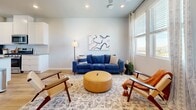 Located at 16600 Peak St in Broomfield, CO, this well-designed multi-floor home offers five bedrooms and five bathrooms spread across three thoughtfully laid-out levels. The entry-level provides a welcoming foundation, while the main living floor serves as the heart of the home. Here, an open-concept kitchen and living room combine seamlessly, featuring light wood-look flooring, recessed lighting, and large windows that invite natural light. The kitchen is outfitted with crisp white shaker cabinetry, quartz countertops, stainless steel appliances including a gas range and French door refrigerator, a white subway tile backsplash, and a peninsula with bar seating. A dedicated dining area with additional natural light sits nearby, ideal for everyday meals or entertaining. A clean, light-toned powder bathroom is also conveniently located on this floor. The upper level houses the bedrooms, including a comfortable primary suite with plush carpeting, large windows with elegant drape panels, and a ceiling fan. Additional bedrooms mirror the same calm, neutral aesthetic. A dedicated laundry room with stacked washer and dryer units adds practical convenience. Throughout the home, a consistent palette of soft grays, white trim, and warm wood tones creates a cohesive, modern atmosphere.