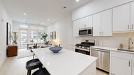 Located at 17-00 Pollitt Dr in Fair Lawn, NJ, this thoughtfully designed one-bedroom, one-bathroom residence offers a clean, modern aesthetic defined by crisp white walls, light hardwood flooring, and abundant natural light throughout. The open-concept kitchen and living area serves as the heart of the home, featuring floor-to-ceiling white cabinetry, a full suite of stainless steel appliances including a gas range, built-in microwave, dishwasher, and French door refrigerator, and a white quartz island that doubles as a casual dining and prep space. The living area is bright and airy, with large windows offering views of the surrounding community and filling the room with natural light. The spacious bedroom continues the home's serene palette, with a large window framing outdoor views and providing a calm, restful atmosphere. Light hardwood flooring runs throughout. The bathroom is finished in neutral tile with a white vanity, frameless glass walk-in shower, and clean modern fixtures. Recessed lighting, roller shades, and consistent modern detailing tie the entire residence together, creating a cohesive and inviting living environment.