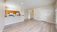 Located at 21759 SE Cedar Brook Way in Sherwood, Oregon, this two-bedroom, one-bathroom residence offers a well-designed single-level layout filled with natural light and modern finishes throughout. Light wood-style flooring flows consistently across the entire space, complementing the warm, neutral wall tones that create a bright and welcoming ambiance.

The open-concept kitchen and living area serves as the heart of the home. The kitchen features warm-toned cabinetry, granite-look countertops, stainless steel appliances including a refrigerator, range, and dishwasher, and recessed lighting overhead. A breakfast bar with decorative red bracket supports extends into the living space, offering a casual dining option. The living area is generously sized with a front entry door and large windows that invite ample natural light and outdoor views.

Both bedrooms are comfortably proportioned with light flooring and windows providing natural light. The primary bedroom includes a ceiling fan and a closet with double doors. The full bathroom features a soaking tub and shower combination, a wood-toned vanity, tile-style flooring, and two windows for ventilation and light.

Additional highlights include a dedicated laundry area, a hallway connecting the main rooms, and five closets distributed throughout, providing exceptional storage for a residence of this scale.