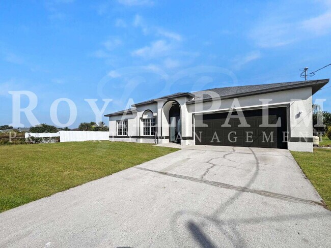 Building Photo - 3BR/2BA Home Ready to Bloom in Lehigh Acres + GARAGE!!