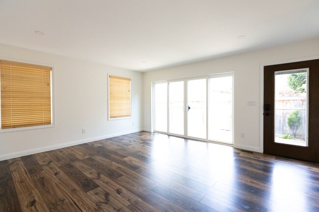 main living space with large sliding doors - 953 Dennison Ave