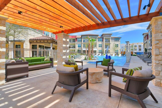 Outdoor Shaded Patio Overlooking Pool Area - Park at Rialto Apartments