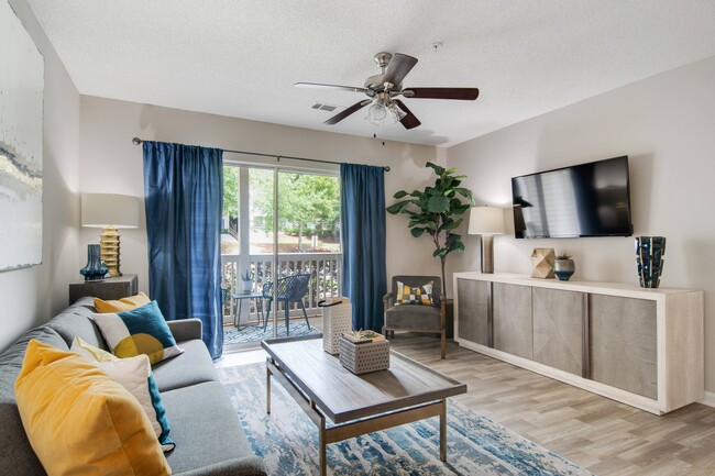 Living Room with Balcony Views - North Park at Eagle's Landing Apartments