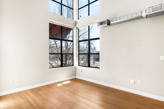 Photo - Modern 2BD, 1.5BA Condo with 20' Ceilings and Garage Parking Spot