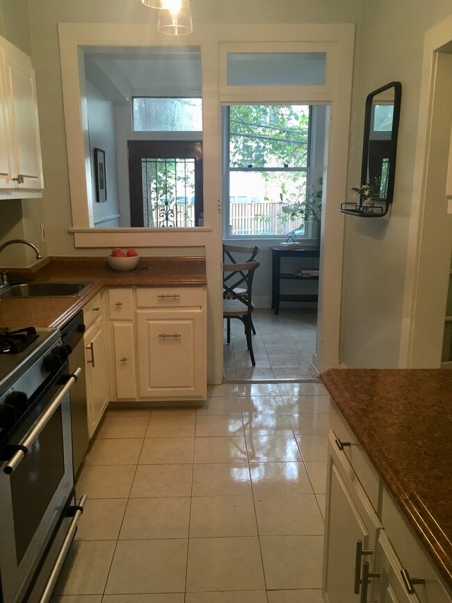 kitchen opening to breakfast porch - 825 Kentucky Ave SE
