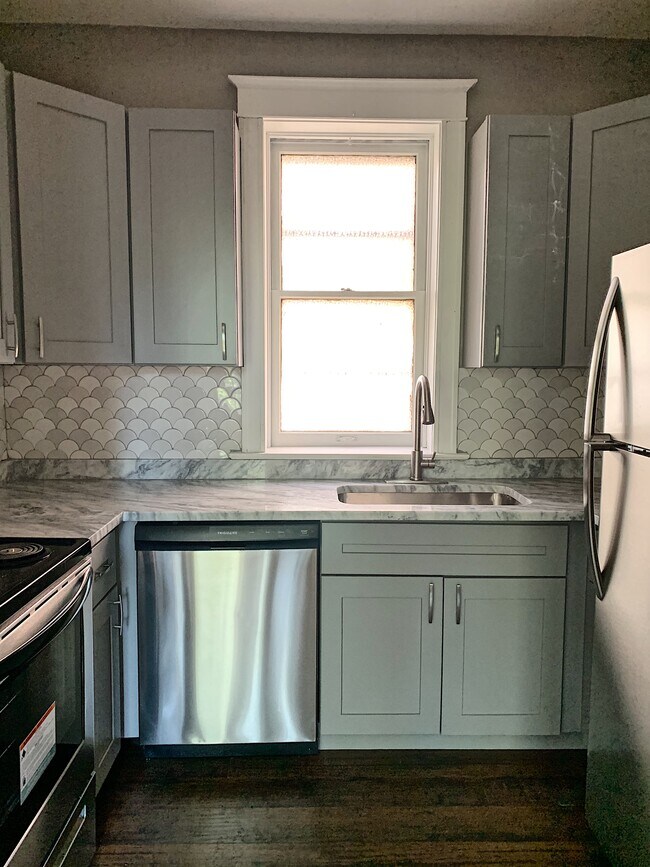 Kitchen with all new stainless steel appliances - 5201 Murdoch Ave