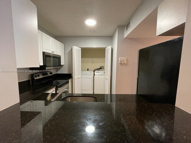 Building Photo - 2731 Ocean Club Blvd  #103