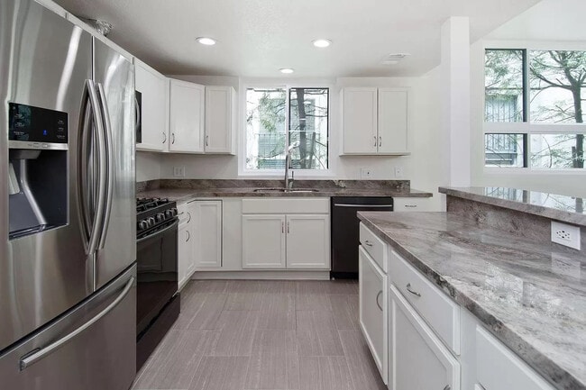 Gorgeous granite countertops and almost-new stainless steel appliances. - 10315 Missouri Ave