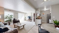 Located at 32002 N Marginal Dr in Willowick, Ohio, this 2-bedroom, 1-bathroom residence offers a well-organized single-floor layout designed for comfortable everyday living. The open-concept living and dining area forms the heart of the home, featuring plush carpeting, neutral tones, and a large sliding glass door dressed with vertical blinds that floods the space with natural light and provides outdoor access. The living room offers generous room for seating and relaxation, flowing seamlessly into the dedicated dining area, which features wood-look flooring and a cozy nook ideal for casual meals. The galley-style kitchen is efficiently designed with white shaker cabinetry, dark granite-style countertops, and a full suite of stainless steel appliances, including a range, microwave, refrigerator, and dishwasher. The primary bedroom is a comfortable retreat with a mirrored sliding closet and natural light from a window, while the second bedroom offers carpeted flooring and additional window light. The shared full bathroom is finished with clean, simple fixtures. Throughout the home, soft neutral wall colors, consistent flooring transitions, and practical storage solutions create a cohesive and functional living environment.