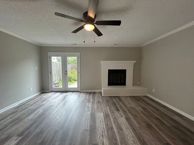 Building Photo - Introducing a charming townhome in the hea...