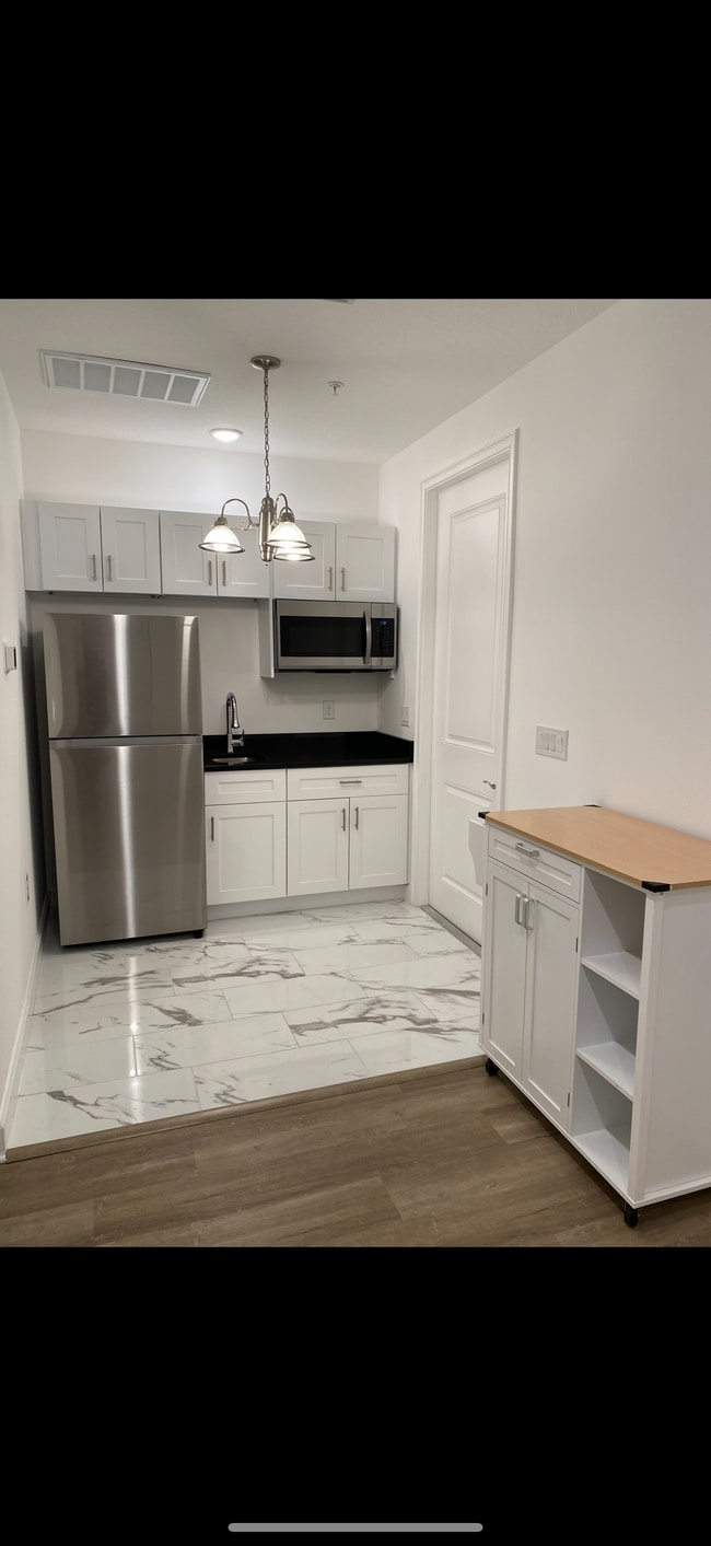 No oven or dishwasher. But portable 2 burner stove top & brand new toaster oven included if desired - 12048 Via Caselli Ln
