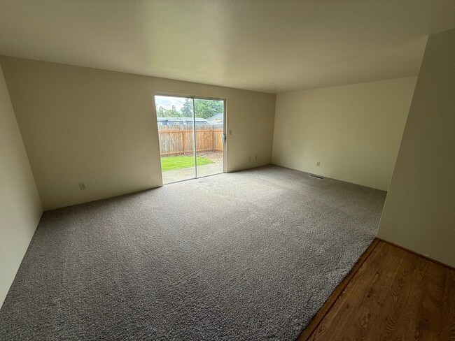 Living room, back yard sliding door - 329 Bessie St