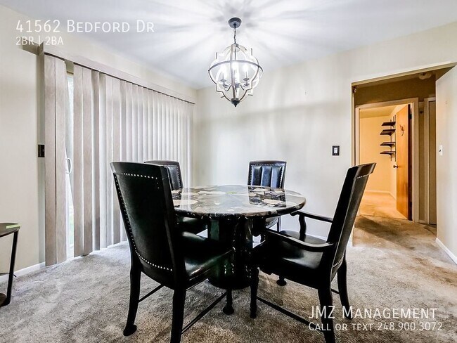 Building Photo - Welcome to this charming 2-bedroom, 1.5-ba...