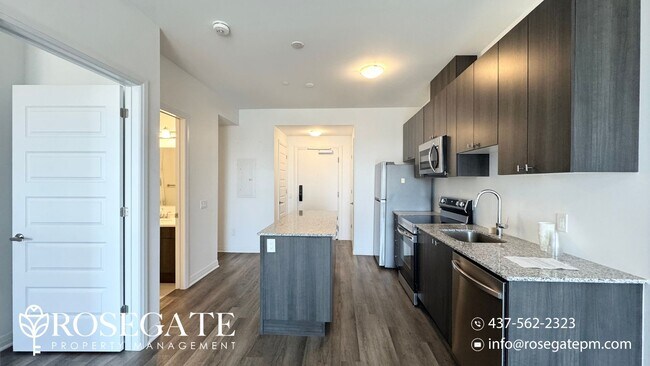 Photo du bâtiment - Modern 1+Den Condo in Milton – 695 Sq Ft w...