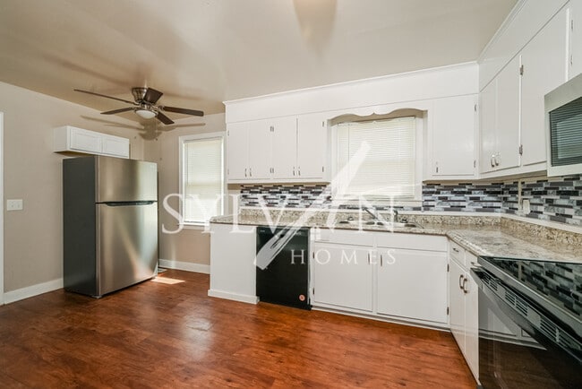Building Photo - The living is easy in this 4 bedroom, 1.5 ...