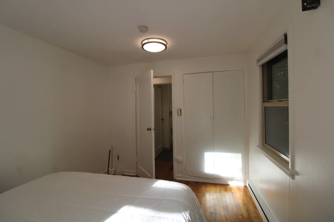 Bedroom showing closet - 9228 37th Ave SW