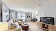 Located at 801 Cooper St in Deptford, NJ, this thoughtfully designed one-bedroom, one-bathroom residence offers a comfortable and functional single-floor layout. The open-concept living and dining area is bright and welcoming, featuring light hardwood-style flooring, large windows with natural light, and a bold navy accent wall that adds a modern touch. The living room provides generous space for seating and entertainment, flowing seamlessly into the dedicated dining area with a stylish pendant light overhead.

The kitchen is well-equipped with white shaker-style cabinetry, granite-look countertops, stainless steel appliances including a refrigerator, range, microwave, and dishwasher, complemented by light flooring that ties the space together. A pantry adds valuable storage.

The spacious primary bedroom features plush carpeting, a soft accent wall, and multiple closet spaces — including double sliding-door closets — offering abundant storage. The bathroom is clean and bright, with a white vanity, ample counter space, and light wood-tone flooring. Additional highlights include a dedicated laundry room and a hallway connecting the key spaces. With four closets throughout, this residence prioritizes practicality without sacrificing style.
