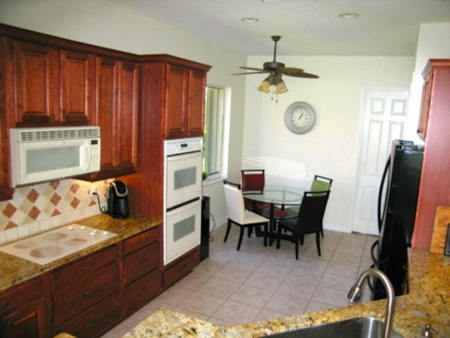 Building Photo - Fully Furnished Pool Home PGA Village
