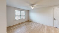 This 680 square foot apartment in Columbia, SC offers a well-designed living space with modern amenities. The single-floor layout features an open-concept living and kitchen area, one bedroom, and one bathroom. The kitchen boasts dark wood cabinetry, stainless steel appliances, and granite countertops, creating a sleek and functional cooking space. Light-colored wood flooring throughout the main living areas adds warmth and continuity.

The bedroom, measuring 170 square feet, includes a ceiling fan and window for natural light and air circulation. The bathroom is equipped with modern fixtures and a over-toilet cabinet for storage. In-unit laundry facilities with full-sized washer and dryer provide added convenience.

Large windows in the living area and bedroom allow ample natural light, while ceiling fans help maintain a comfortable temperature. The neutral color palette and clean lines contribute to a contemporary aesthetic. This efficiently designed apartment maximizes its 680 square feet, offering a comfortable living space with updated finishes and appliances.