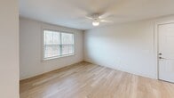 This 680 square foot apartment in Columbia, SC offers a well-designed living space with modern amenities. The single-floor layout features an open-concept living and kitchen area, one bedroom, and one bathroom. The kitchen boasts dark wood cabinetry, stainless steel appliances, and granite countertops, creating a sleek and functional cooking space. Light-colored wood flooring throughout the main living areas adds warmth and continuity.

The bedroom, measuring 170 square feet, includes a ceiling fan and window for natural light and air circulation. The bathroom is equipped with modern fixtures and a over-toilet cabinet for storage. In-unit laundry facilities with full-sized washer and dryer provide added convenience.

Large windows in the living area and bedroom allow ample natural light, while ceiling fans help maintain a comfortable temperature. The neutral color palette and clean lines contribute to a contemporary aesthetic. This efficiently designed apartment maximizes its 680 square feet, offering a comfortable living space with updated finishes and appliances.