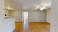 Located at 650 S San Ildefonso Rd in Los Alamos, NM, this single-floor, 2-bedroom, 1-bathroom home offers a practical and comfortable layout. The open living room features light hardwood-style flooring, a ceiling fan, textured ceilings, and a sliding glass door that fills the space with natural light and provides outdoor access. Adjacent to the living room, the kitchen is well-appointed with light wood cabinetry, ample counter space, a gas range, refrigerator, dishwasher, and a stainless steel sink — all finished with hardwood-style flooring for a cohesive look. The primary bedroom is a comfortable size, featuring plush carpet, a window with natural light, and mirrored sliding closet doors that add depth to the room. The second bedroom also offers carpet flooring, a window, and a mirrored sliding closet, along with convenient access to a hallway with built-in shelving. The bathroom is well-equipped with a tub/shower combo featuring grab bars, a single vanity with light wood cabinetry, a gray countertop, and hardwood-style flooring. A dedicated entrance and hallway complete this efficiently designed home, making it a practical option in the Los Alamos community.
