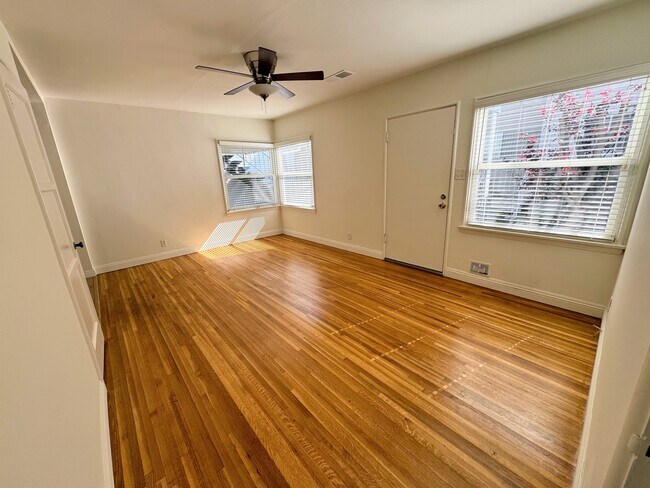 Living room - front door also opens to a retractable screen door for additional light and air - 839 21st St