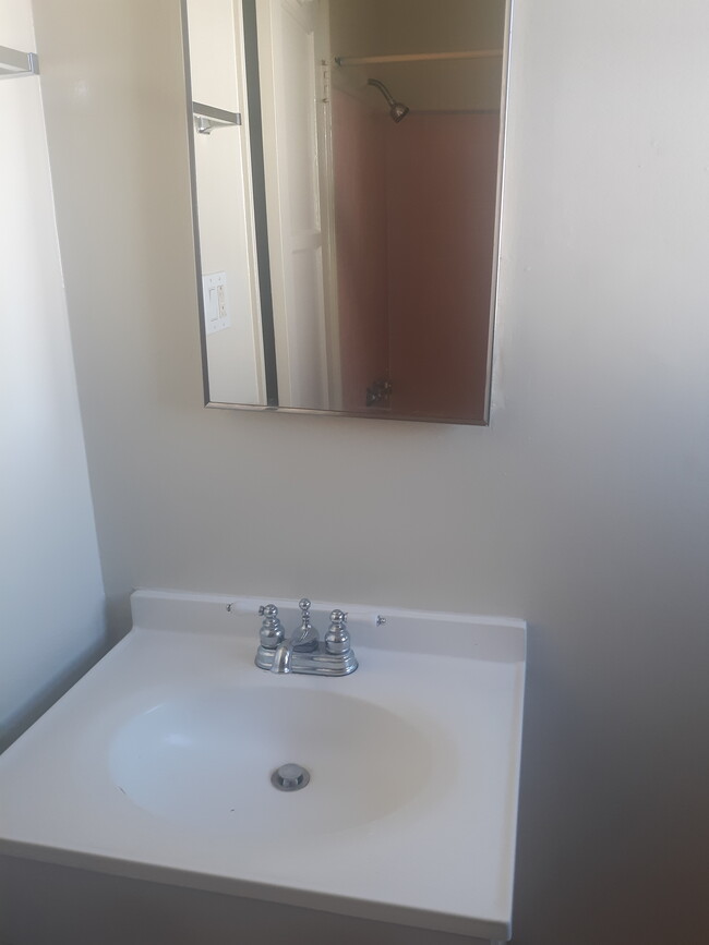 bathroom sink area reflection of shower over tub - 12063 1/2 Hoffman St