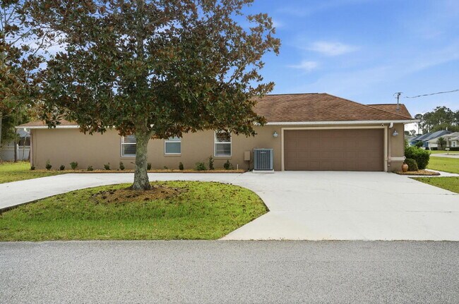 Building Photo - "Charming 3-Bedroom Home with 2 Full Baths and 2032 Sq Ft of Comfort in Palm Coast!"