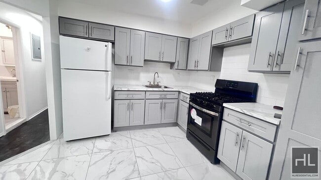 Building Photo - GUT RENOVATED VERY LARGE 3 BEDEROOMS W/ PR...