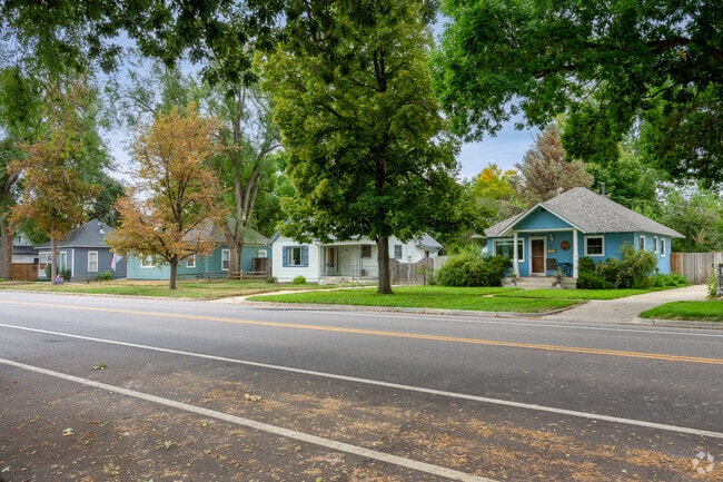 A row of bungalows sit among trees in the quiet neighborhood of Sunset.