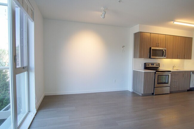 Foto del edificio - Modern & Sleek 1Bdr w/Floor-to-Ceiling Win...