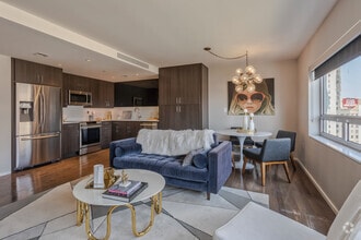 1BR, 1.5BA - 722SF -  The Linda Lee - Living Area - The Statler Residences