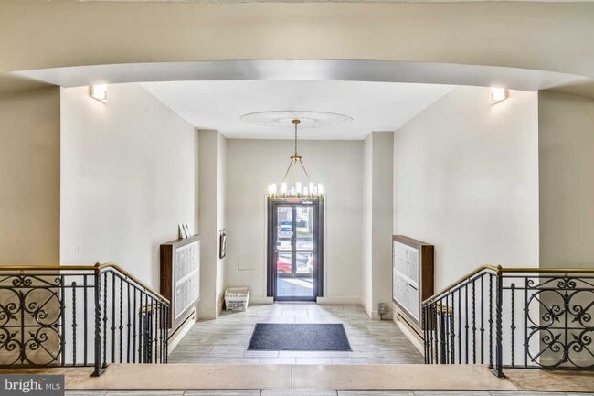 Building lobby with locked mailboxes for each unit - 3719 12th St NE