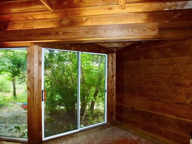 Huge high ceiling living with walls of glass with tree views - 305 Brentwood St